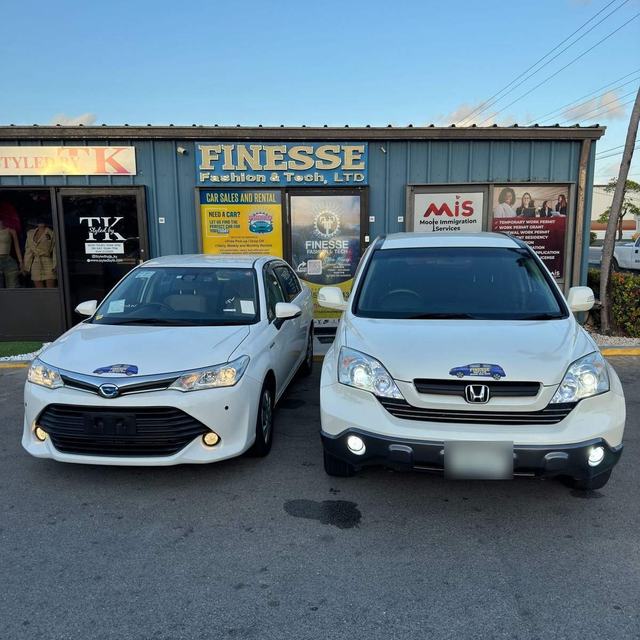Rental cars outside the Finesse office