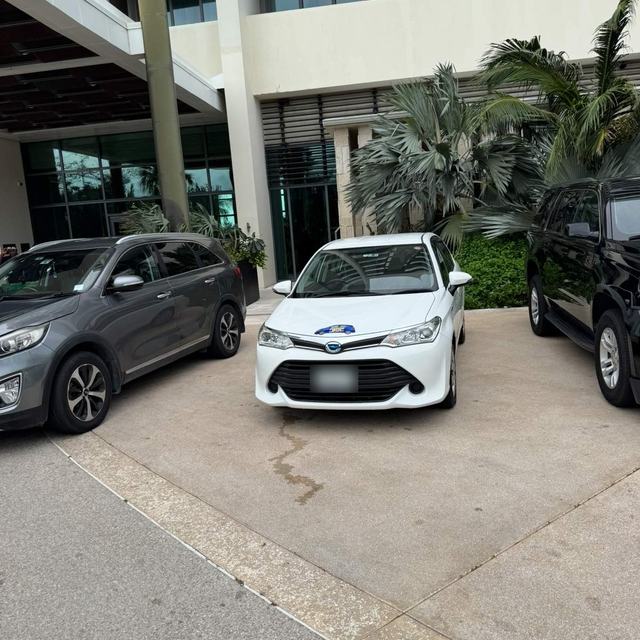 White Corolla at a hotel